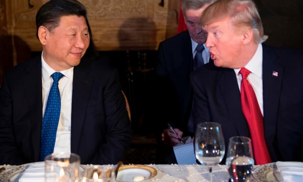 President Donald Trump talks to Chinese President Xi Jinping during dinner at the Mar-a-Lago estate in Palm Beach, Florida. Photograph: Jim Watson/AFP/Getty Images