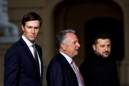 three men stand near each other