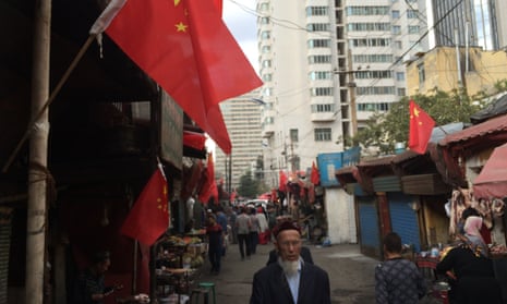 Chinese flags in the western region of Xinjiang, where the editor of the state-run newspaper has been sacked for “improperly” discussing Beijing’s policies in the violence stricken area.<br>