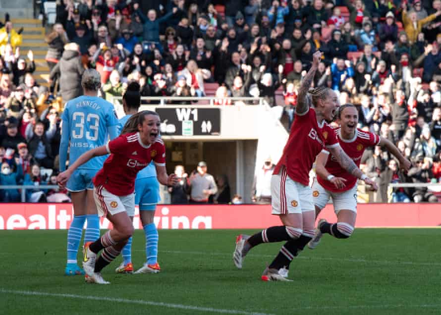 Manchester United players Ella Toone (left), Leah Galton (centre) and Martha Thomas (right) celebrate captain Katie Zelem's goal straight from a corner.