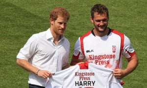 Prince Harry is presented with a personalised Leeds Rhinos shirt in his early days as patron of the Rugby Football League