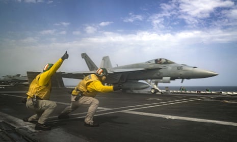 An F-18 Super Hornet takes off from the deck of the USS Abraham Lincoln aircraft carrier in the Arabian Sea.