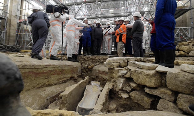 France's culture minister Roselyne Bachelot (centre left) visits the Notre Dame cathedral archaeological research site after the discovery of a 14th century lead sarcophagus.
