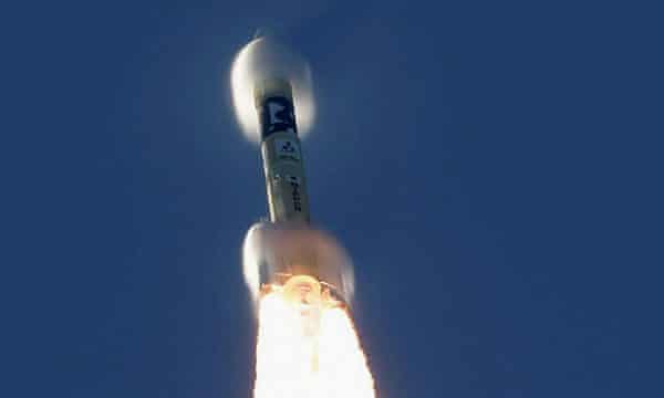 An H-2A rocket carrying the Hope Probe lifts off from the launching pad at Tanegashima Space Center