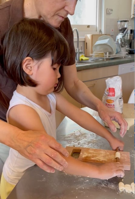 Riccardina and her granddaughter shaping dough.