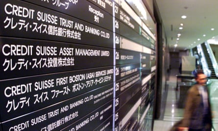 Credit Suisse signboards at the lender’s Tokyo office in 1999.