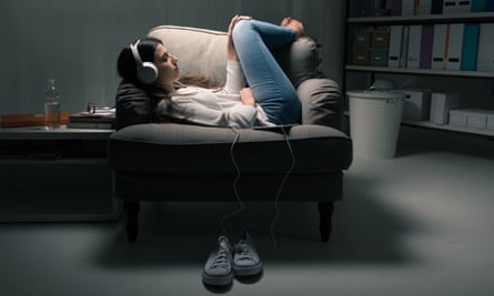 Girl relaxing in a chair with headphones on