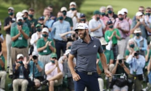 Dustin Johnson of the US reacts after sinking his putt to win the 2020 Masters.