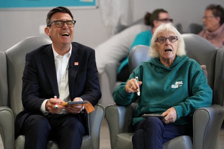 Andy Burnham and Brenda Ficociello play bingo.