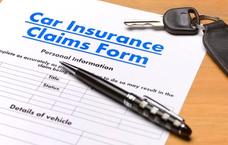 A car insurance claim form, a pen and a car key