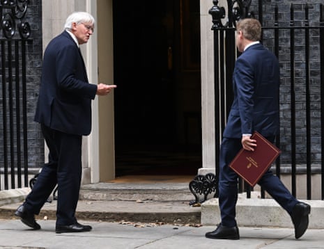 Andrew Mitchell (left) and Grant Shapps, the defence secretary, arriving for cabinet this morning.