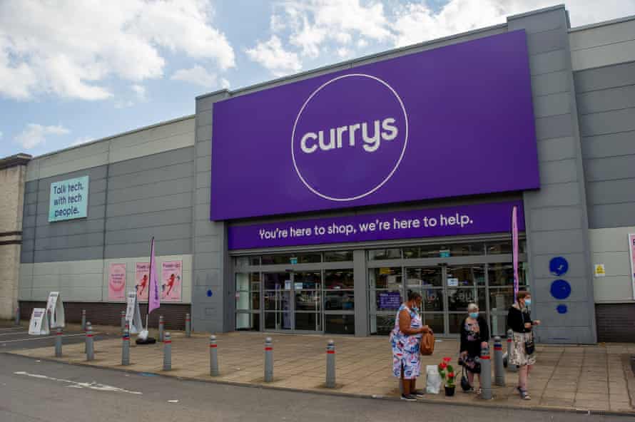 Currys store exterior with customers in front
