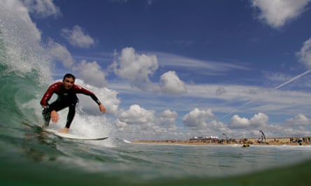 A man surfs a wave in Hossegor on the south west coast of France