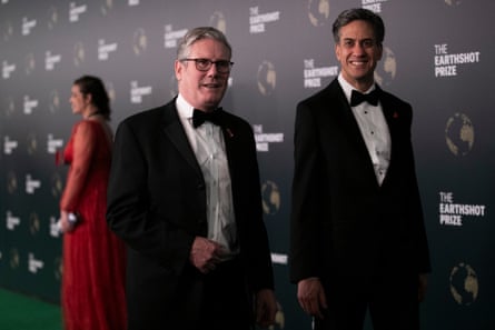 Miliband and Starmer in tuxedo black tie on the red carpet of an event