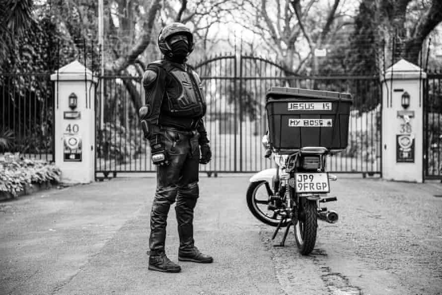 Ghost riders: the invisible lives of Johannesburg food couriers – photo essay | South Africa 17 Pardon Sibanda in his protective wear