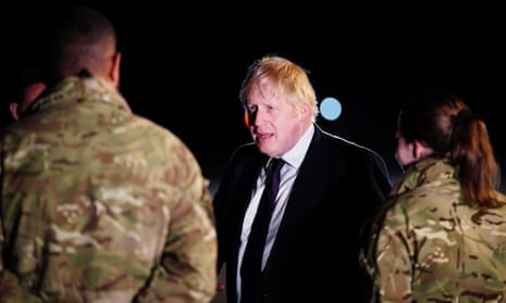 Boris Johnson meeting military personnel at RAF Brize Norton in Oxfordshire.