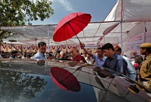 The Dalai Lama leaves after visiting a leprosy colony in New Delhi in 2014.