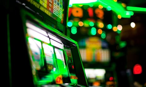 slot machines photographed in a murky green light