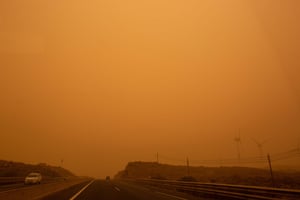 Cars drive on the TF-1 highway during the sandstorm in Santa Cruz de Tenerife