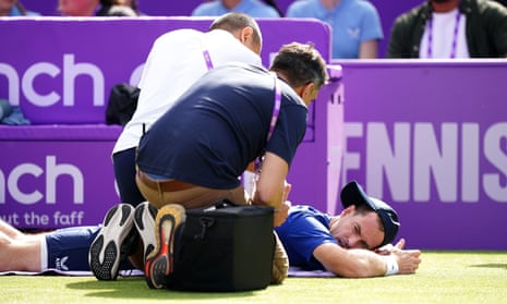 Andy Murray receives treatment before withdrawing from his match against Jordan Thompson at the Queen’s Club on Wednesday 19 June