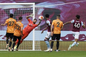 Wolves’ goalkeeper Rui Patricio leaps to make the save.