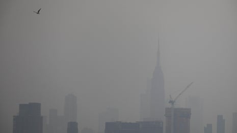 Aerial shots of New York show hazy skies from western US wildfires – video