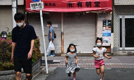 children run in a Japan street