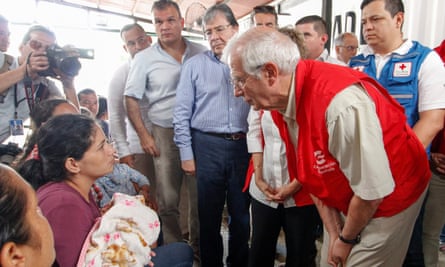 Borrell talks to Venezuelan migrants during a visit to the Simon Bolivar international bridge at the border of Colombia and Venezuela