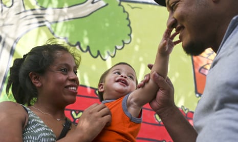 Baby Johan is reunited with his Adalicia Montecinos and Rolando Bueso Castillo’s face, in San Pedro de Sula, Honduras, on 20 July, after a five-month separation.