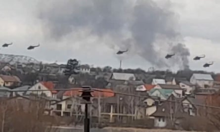 Military helicopters apparently Russian, fly over the outskirts of Kyiv, Ukraine