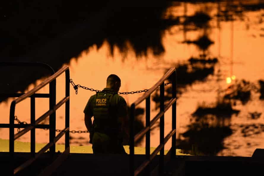 silhouette of agent against an orange sky