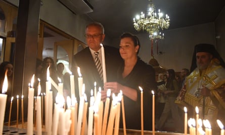 Scott Morrison lights candles at Greek Orthodox Easter service at the Greek Orthodox church in Kogarah, Sydney