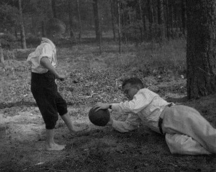 An early photograph of Dmitri Shostakovich playing football with his son Maxim in Komarovo.