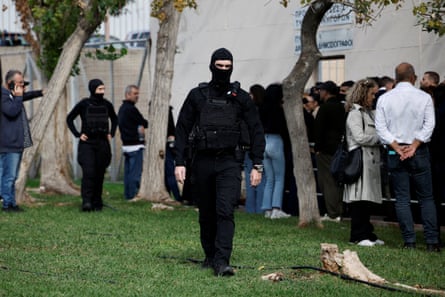 Masked police officers were on duty outside Athens’ high security Korydallos prison when the trial over sports-related violence began on Wednesday.
