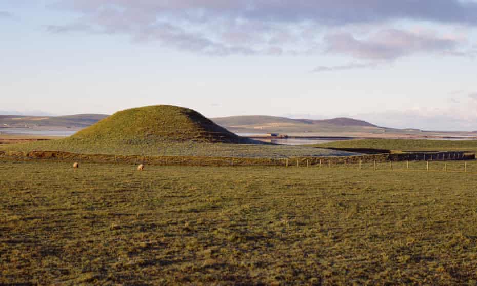 The Maeshowe neolithic burial mound tomb and Loch of Harray, Orkney.