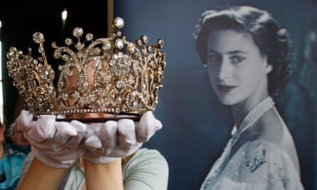 An employee of Christie's auction house holds the Poltimore tiara worn by Princess Margaret at her wedding.