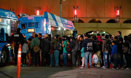 Asylum seekers board a bus after they were dropped off by Ice officials earlier at the Greyhound bus station in downtown El Paso, Texas, late on 23 December.