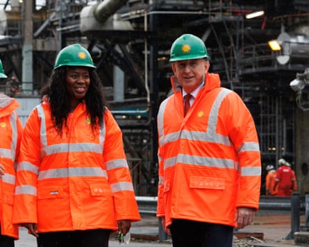 Fahnbulleh and Healey wearing hi-vis jackets and hard hats