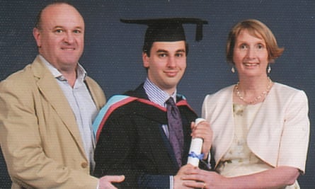 Elliott Johnson at his graduation with his parents.