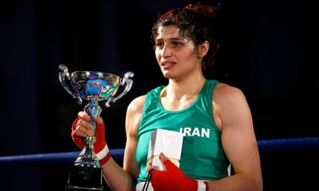 Sadaf Khadem is presented with the trophy after beating Anne Chauvin in their boxing match in Royan.