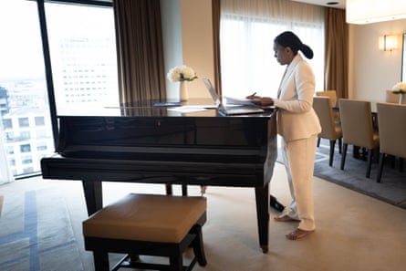 Kemi Badenoch uses a piano as a desk as she prepares her conference speech in her hotel room