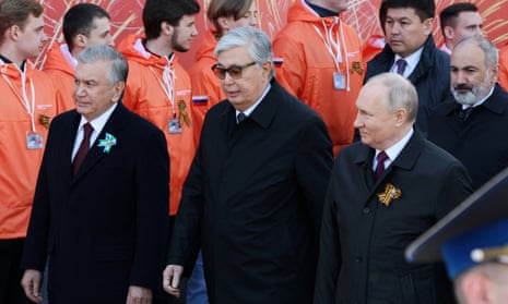Vladimir Putin with the Kazakh president, Kassym-Jomart Tokayev (c), and the Uzbek president, Shavkat Mirziyoyev (l), on Victory Day