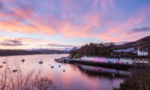 Pink light at Portree harbour during a Winter sunset. Isle of Skye, western Scotland.