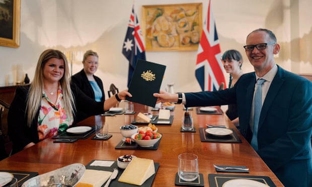 The signing at the Australian High Commission in London where a deal was made to allow the UK to export twelve varieties of raw milk cheese to Australia. July 20th 2022. Back left – Carly Stevens, Counsellor (Economic) Department of Foreign Affairs and Trade (Aus) Front left – Natalie Browning, First Secretary (Agriculture) at Australian High Commission London Back right – Nelly Brewer, Policy Advisor, Department for Food, Environment and Rural Affairs (UK) Front right – Dr Robert Irvine, Deputy Chief Veterinary Officer, Department for Food, Environment and Rural Affairs (UK)