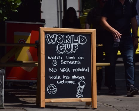 A sign outside a pub in Central London advertises World Cup screenings as the government allowed pubs to remain open until 5am for the football match between England and Mexico