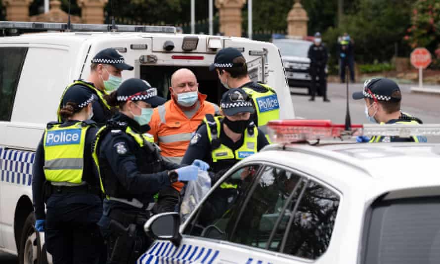 A protester is released by police during an anti-lockdown protest in Melbourne