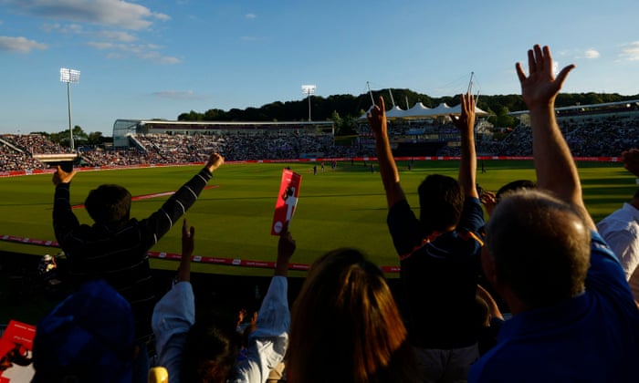 India fans celebrate after England’s Jos Buttler is dismissed.