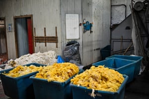 White and yellow wool in plastic boxes