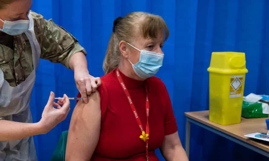 A woman being vaccinated