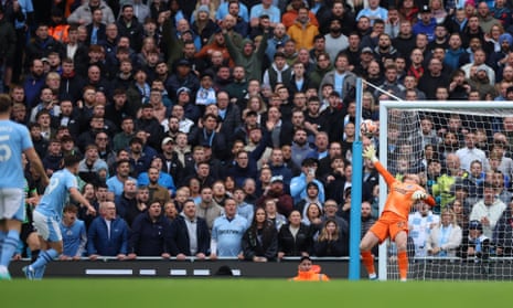 Manchester City's Julian Alvarez scores their first goal against Brighton.
